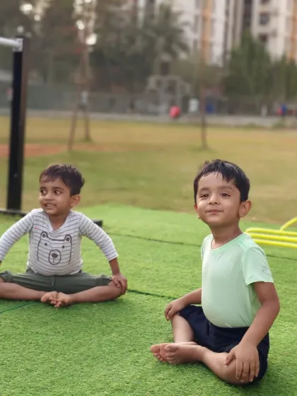 Two of our youngest CaliGang members practice the butterfly pose (Baddha Konasana) to open their hips. It's never too early to start building good mobility habits.