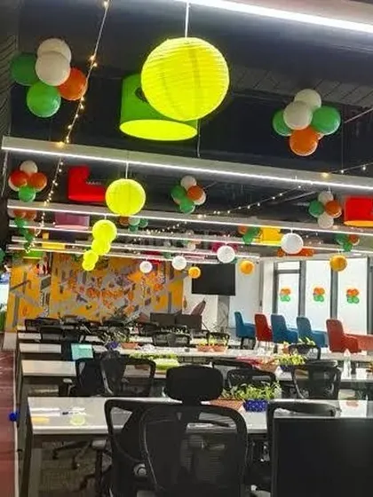 I transformed this modern office space for a Republic Day celebration using a mix of tricolor balloon clusters and vibrant paper lanterns. This approach adds festive energy without disrupting the professional environment.