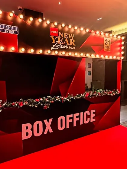 A 'Box Office' themed entrance for a New Year's Eve party at Goregaon Sports Club. This creative entryway, complete with a red carpet and marquee lights, built excitement right from the moment guests arrived.