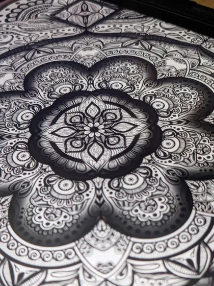A close-up look at the heart of one of my mandala designs. I find so much joy in the details, creating patterns within patterns. This is where my passion for doodling really comes alive, filling spaces with intricate, meditative designs.
