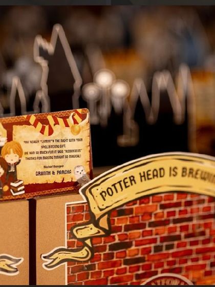 A close-up of the handcrafted details on my Harry Potter hampers, including a personalized thank you card with wizarding world puns.