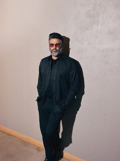 A full-length shot showing the layered, monochromatic look that is both intimidating and incredibly stylish.