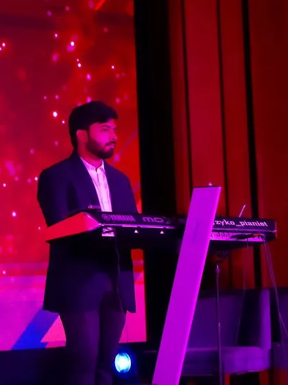 Our keyboardist focused on the music during our performance for the EliteCISOs Enterprise Security Summit at Taj Yeshwantpur.