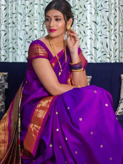 A full view of the elegant look, showing how the makeup and hair work in harmony with the traditional attire.