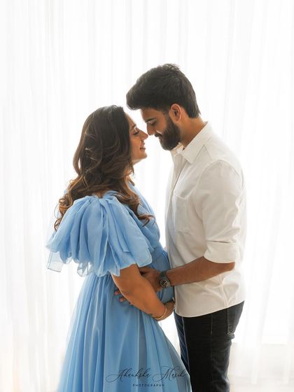An intimate close-up from a maternity session. This shot focuses on the loving gaze between the couple, highlighting their bond as they await their baby.