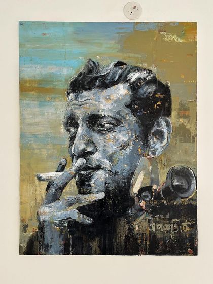 The Satyajit Ray portrait, hung and ready for display. This shows how the artwork commands attention on a simple wall, becoming an instant conversation starter.