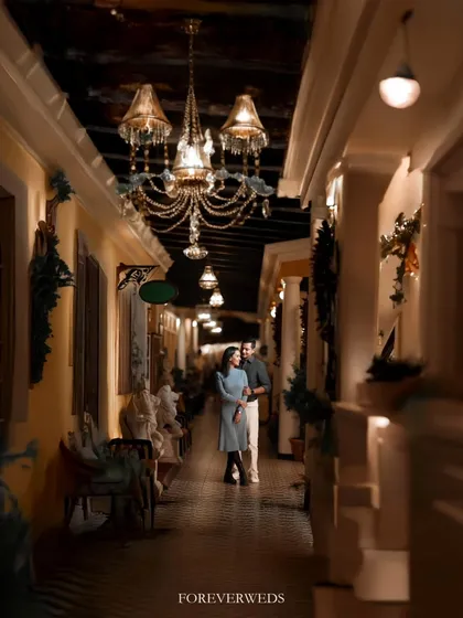 The right location can transport you. This elegant, warmly lit corridor gave Atul and Rachita's pre-wedding shoot a timeless, almost European feel. I love using architectural details and ambient light to create a mood of sophisticated romance.