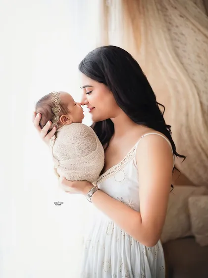 Those first few days are so precious. This tender moment between a mother and her newborn is captured in a soft, natural light to highlight that incredible bond. I focus on creating a calm space for these delicate newborn and parent portraits.