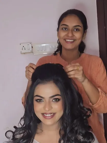 A behind-the-scenes shot of me creating a classic Christian wedding look. The hairstyle is a modern updo with soft curls, perfect for a gown.