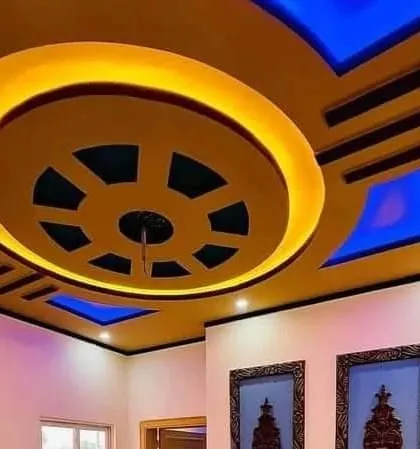 This design uses a strong yellow and blue color combination. The central wheel-like structure is the main feature, creating a very dramatic look.
