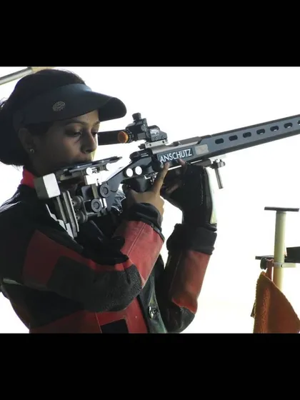 A close-up of a national squad athlete with her Anschutz rifle during a training session, highlighting the professional-grade equipment used at my facility.