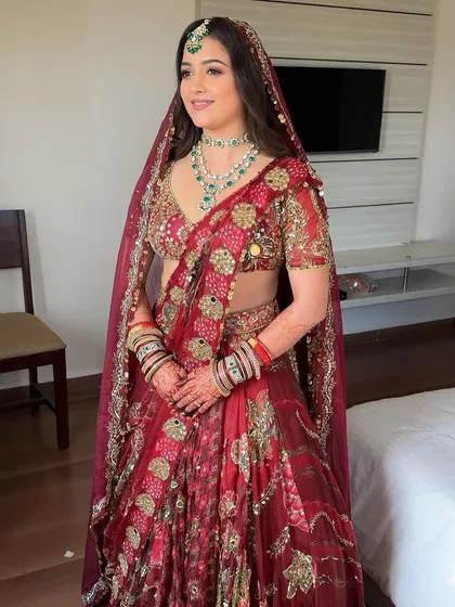 A full-length view of this stunning bride. The makeup was designed to be as memorable as her outfit, creating a cohesive and timeless bridal look.