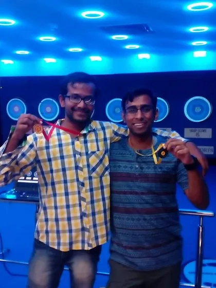 Two friends proudly displaying their medals. It is always great to see customers encouraging each other and celebrating their shared success.