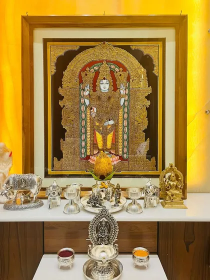 Our Lord Venkateshwara Swamy painting transforms this client's pooja room into a divine sanctuary. The artwork, with its heavy gold work, becomes the centerpiece of their sacred space.