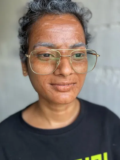 A close-up of the incredible detail in the old-age makeup, showing the realistic wrinkles and skin texture created by our student.