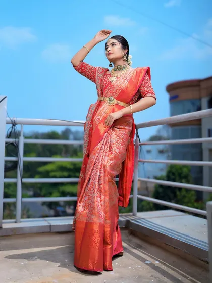 This is the classic South Indian muhurtham bridal look I love to create. I focus on draping heavy silk sarees to create a majestic yet comfortable feel, ensuring the pleats are perfect and the traditional oddiyanam belt sits beautifully.