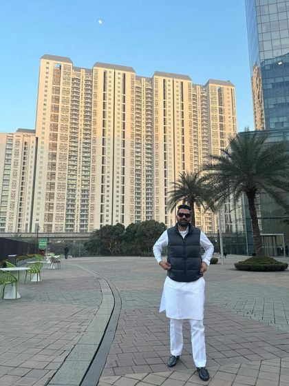 Another pose in the same urban setting, reflecting on my journey. Life is about moving forward, leaving worries behind like smoke.