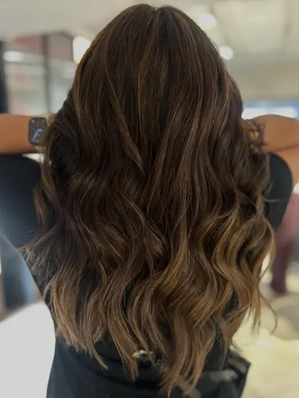Here is a warm two-tone balayage blend that adds richness and depth. I used a combination of beige and blonde highlights to create this beautiful, multi-tonal effect.