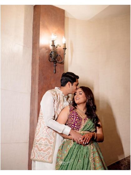 A tender forehead kiss, a sweet and intimate moment from Varshikha and Nikunj's Roka ceremony.