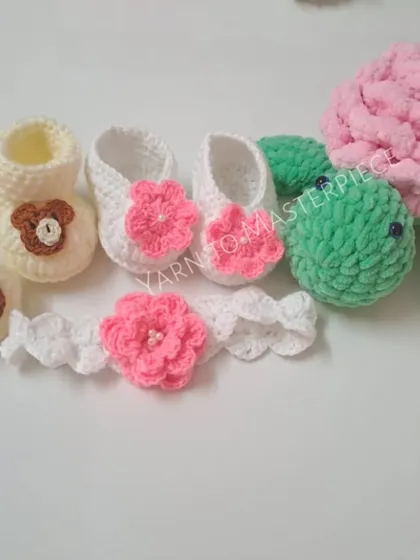 A colorful gift set combining bear-themed booties, a floral headband and shoe set, and a plush turtle toy, offering a little bit of everything.
