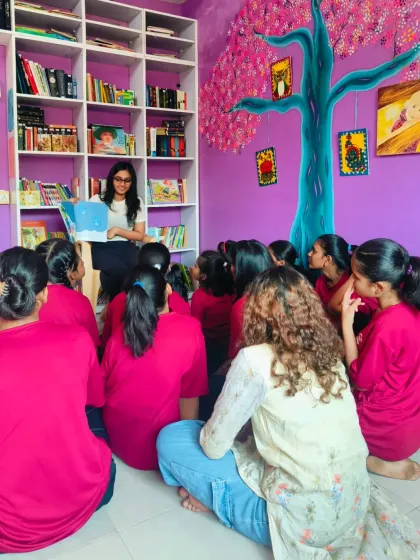 A volunteer reads "The Worrysaurus" to a group of girls at our Library of Hope. The session sparked a heartfelt discussion about worries and fears, helping the children learn that it's okay to feel anxious and that these feelings can pass.