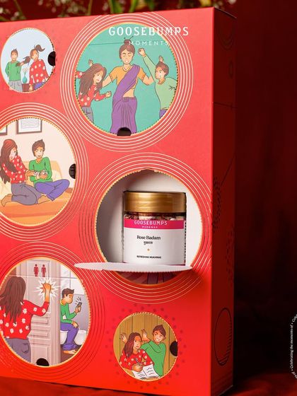 My Raksha Bandhan box features nostalgic illustrations with perforated areas. As you can see here, you can rip open a window to discover a hidden treat, like this jar of Rose Badam Mukhwas.