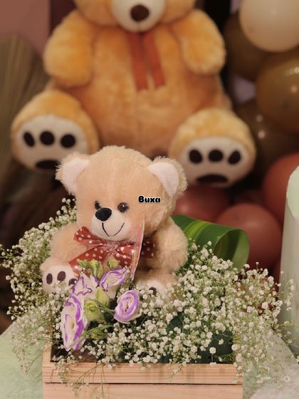 We can "bearly" wait! This teddy bear themed centerpiece, set in a pinewood basket with baby's breath, was the heart of a beautiful baby shower setup I helped create.
