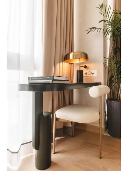 Another angle of the workspace, highlighting the sleek lines of the custom desk and the comfortable, stylish chair.