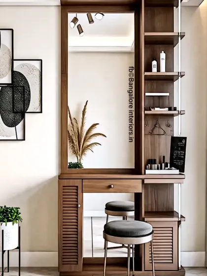 A functional and elegant dressing table unit we designed. It includes a large mirror with integrated lighting, open shelves for easy access to products, and closed cabinets for concealed storage.