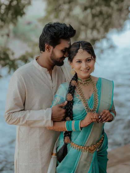 A sweet and romantic pose. The bride's traditional look is perfect for this beautiful, natural setting.