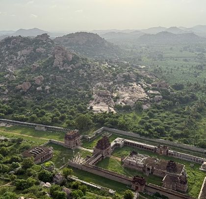 An aerial view of the Elephant Stables and other ruins in Hampi. The scale of the ancient city is breathtaking.
