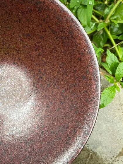 This bowl is from a batch that failed due to over-reduction, but we found a different kind of beauty in the result. The dark, metallic finish is unexpectedly stunning.
