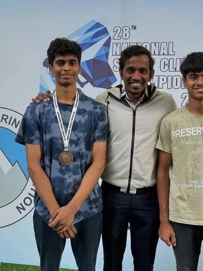 This is what our high-performance training looks like. Here are two of our junior climbers with their coach, Shiva, after a successful run at the National Sport Climbing Championship. We build champions here.