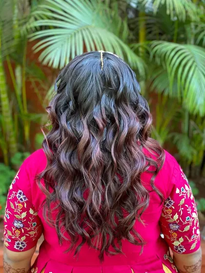 Another look at these beautiful beachy waves. The subtle highlights in her hair really pop with this wavy texture.