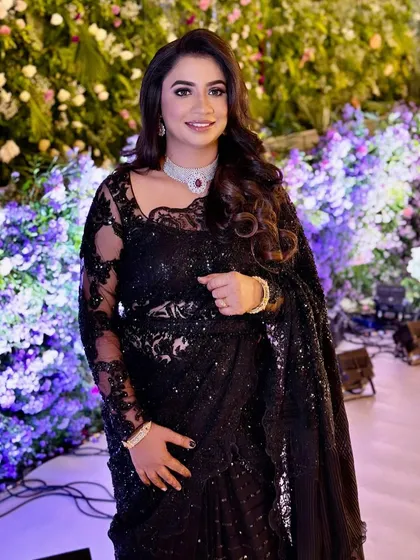 A smiling portrait that captures the sparkle of the outfit and the client's joy.