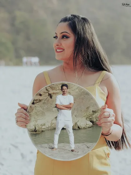 An artistic photo using a mirror to create a "picture within a picture." This is a fun and creative technique I use to make your pre-wedding photos stand out.