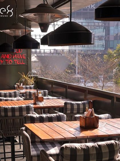 The stylish outdoor seating area at one8 Commune. With its modern decor and city views, it's an ideal spot for enjoying brunch, sunset cocktails, or a relaxed dinner.