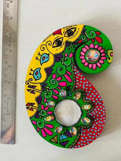 This paisley-shaped candle holder is hand-painted with bright, festive colors and embellished with my custom art cabochons. It's about 6 inches long, perfect for a side table.