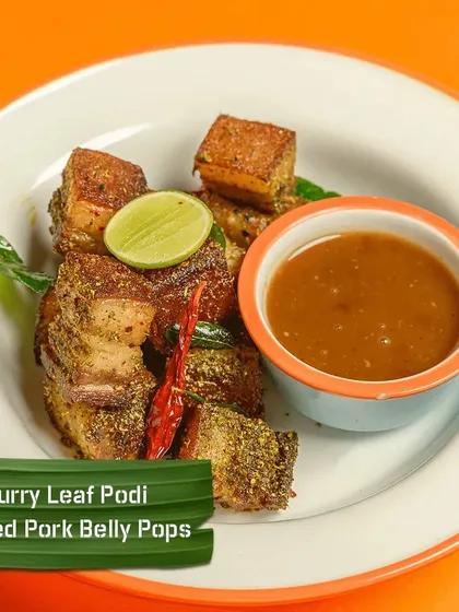 These are my Curry Leaf Podi Tossed Pork Belly Pops. Crispy on the outside and tender on the inside, these bites are tossed in a fragrant curry leaf spice powder for a unique South Indian flavour.