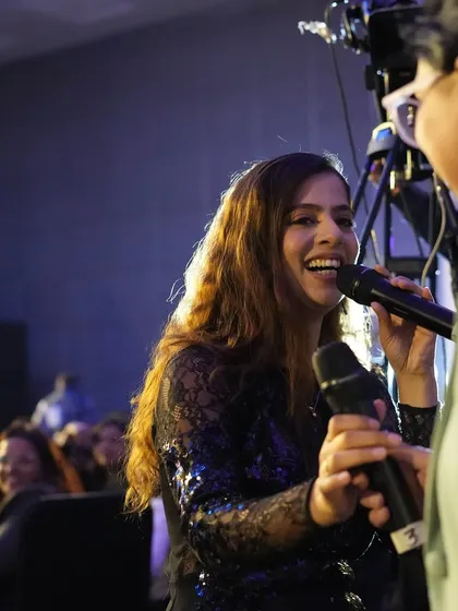 Interacting with an audience member during the Hyundai event. Making personal connections helps create a more engaging and memorable experience for everyone.
