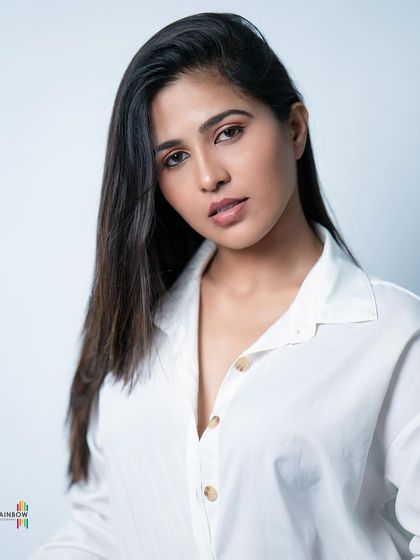 A minimalist studio headshot. This clean and simple portrait is perfect for an actor's portfolio, focusing entirely on the subject's expression.