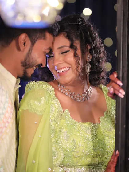 A moment of pure happiness. This candid shot shows how her radiant makeup and beautiful curls come together to create a joyful and stunning Carnival look.