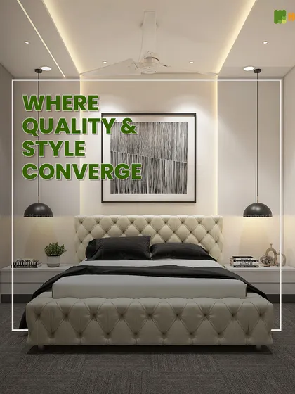 Where quality and style converge. A tufted, off-white leather bed and headboard create a luxurious centerpiece in this bedroom, complemented by modern pendant lights and a clean, minimalist aesthetic.