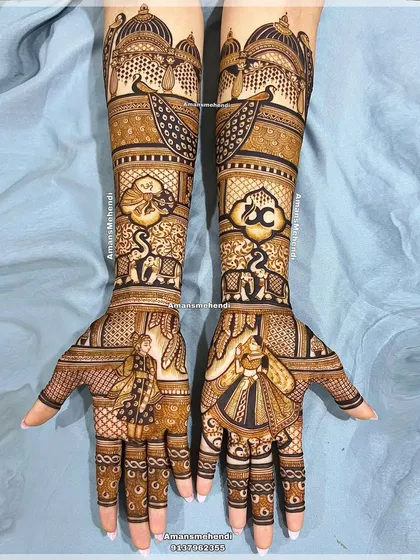 A full view of an elegant and detailed bridal design. The hands feature couple portraits, custom logos, and a rich tapestry of traditional motifs like peacocks and elephants.