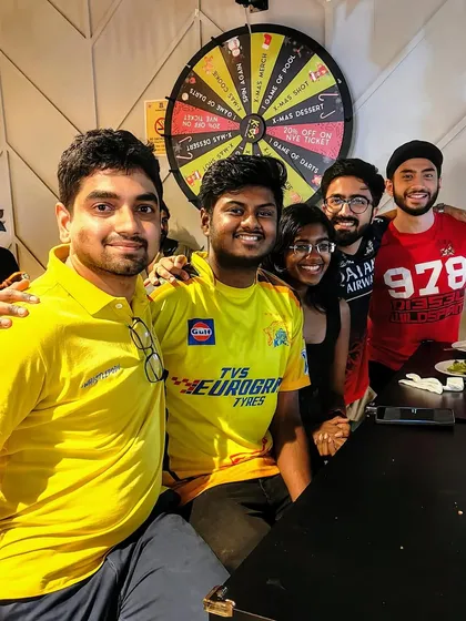 Fans representing different IPL teams, all united by their love for cricket and a good time.