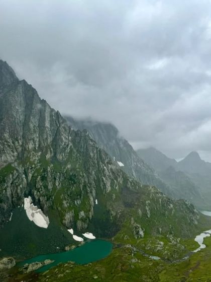 A moody, atmospheric view of the twin lakes, Vishansar and Kishansar, on a cloudy day. The beauty of Kashmir is profound in all weather.