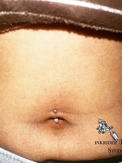 A close-up of a healed navel piercing. With proper care, your piercing will look great for years to come.