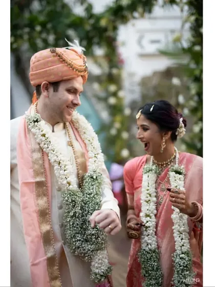 A candid moment of shared laughter between the bride and groom. Their natural chemistry and happiness are the true centerpiece of the wedding day, a testament to a love story we were honored to help celebrate.