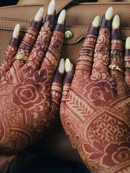 A close-up of a gorgeous, mature stain. The color is so deep and rich, especially on the fingers, which is a sign of high-quality, pure henna.