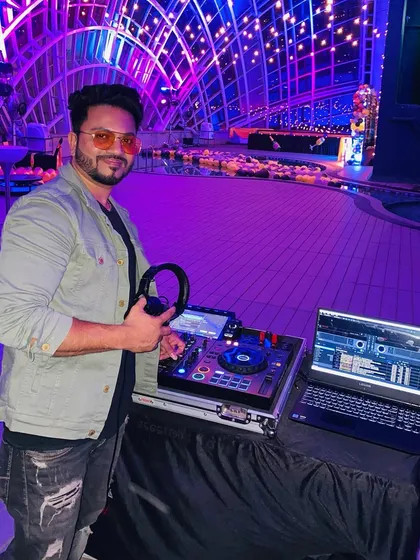 Your event's setting deserves the right soundtrack. Here I am at an upscale poolside party, creating a cool, sophisticated vibe that matched the beautiful venue. I can curate a playlist for any atmosphere.